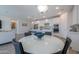 Modern kitchen with white cabinets, patterned backsplash and an island at 9515 E Rainbow Ave, Mesa, AZ 85212
