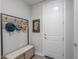 Bright entryway with bench, hooks, and mirror at 9515 E Rainbow Ave, Mesa, AZ 85212