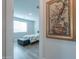 Bedroom with a queen bed, window, and decorative wall art at 9515 E Rainbow Ave, Mesa, AZ 85212
