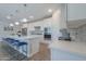 Bright kitchen with white cabinets, quartz countertops, and stylish backsplash at 9515 E Rainbow Ave, Mesa, AZ 85212