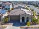 Single story home with tile roof, two-car garage, and desert landscaping at 9515 E Rainbow Ave, Mesa, AZ 85212