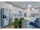 Modern kitchen with stainless steel appliances and white cabinets at 9515 E Rainbow Ave, Mesa, AZ 85212
