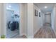 Convenient laundry room with washer, dryer, and shelving at 9515 E Rainbow Ave, Mesa, AZ 85212