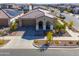 One-story home with tile roof, two-car garage, and landscaped yard at 9515 E Rainbow Ave, Mesa, AZ 85212