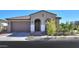 Single story home with a two-car garage and desert landscaping at 9515 E Rainbow Ave, Mesa, AZ 85212