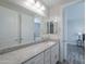 Bathroom with granite countertop, double sinks, and a large mirror at 9515 E Rainbow Ave, Mesa, AZ 85212
