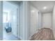 Clean and bright hallway with wood-look flooring at 9515 E Rainbow Ave, Mesa, AZ 85212