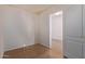Small bedroom with tile flooring and door to hallway at 2101 S Meridian Rd # 172, Apache Junction, AZ 85120