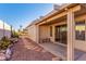 Covered patio with flagstone path, desert landscaping, and built-in bench at 2101 S Meridian Rd # 172, Apache Junction, AZ 85120