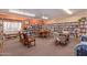 Community library with bookshelves, tables, and comfortable chairs at 2101 S Meridian Rd # 172, Apache Junction, AZ 85120