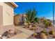 Landscaped front yard with drought-resistant plants and gravel at 2101 S Meridian Rd # 172, Apache Junction, AZ 85120