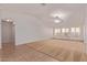 Bright living room with tile flooring, high ceilings and access to hallway at 2101 S Meridian Rd # 172, Apache Junction, AZ 85120