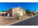 View of the home's exterior, showcasing the garage and desert landscaping at 2101 S Meridian Rd # 172, Apache Junction, AZ 85120