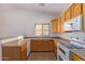 Modern kitchen featuring oak cabinets and white appliances at 2101 S Meridian Rd # 172, Apache Junction, AZ 85120