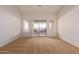 Bright bedroom with neutral carpeting and sliding glass doors at 2101 S Meridian Rd # 172, Apache Junction, AZ 85120