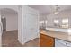 Kitchen boasts oak cabinets, pantry, and view to living room at 2101 S Meridian Rd # 172, Apache Junction, AZ 85120