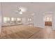 Spacious living room with neutral carpet and French doors at 2101 S Meridian Rd # 172, Apache Junction, AZ 85120
