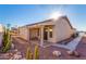 Backyard view showcasing a patio, landscaping, and a walkway at 2101 S Meridian Rd # 172, Apache Junction, AZ 85120