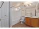 Clean bathroom with wood vanity, tub, and mirror at 2101 S Meridian Rd # 172, Apache Junction, AZ 85120