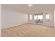 Spacious bedroom with carpeting, sliding door to patio, and ceiling fan at 2101 S Meridian Rd # 172, Apache Junction, AZ 85120