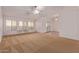 Bright and airy living room with a ceiling fan and carpet flooring at 2101 S Meridian Rd # 172, Apache Junction, AZ 85120