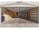 Two-car garage with storage cabinets and shelving at 2101 S Meridian Rd # 172, Apache Junction, AZ 85120