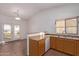 Kitchen with oak cabinets, a double sink, and backyard access at 2101 S Meridian Rd # 172, Apache Junction, AZ 85120