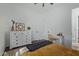 Bright bedroom with dresser, desk, and comfortable bedding at 22474 S 199Th Cir, Queen Creek, AZ 85142