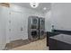 Laundry room with modern washer and dryer, and herringbone floor at 22474 S 199Th Cir, Queen Creek, AZ 85142