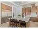 Modern kitchen with stainless steel appliances and a large kitchen island at 22474 S 199Th Cir, Queen Creek, AZ 85142
