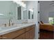 Bathroom with double vanity, marble countertop, and large shower at 22474 S 199Th Cir, Queen Creek, AZ 85142