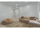 Bright Gathering room featuring a sectional sofa and beanbag chair at 22474 S 199Th Cir, Queen Creek, AZ 85142