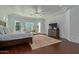 Spacious main bedroom with king-size bed, hardwood floors, and a sitting area at 22474 S 199Th Cir, Queen Creek, AZ 85142