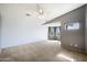 Spacious bedroom with carpeted floors and a large window offering natural light at 4512 W Stoneman Dr, Anthem, AZ 85086