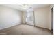 Spacious bedroom with carpeted floors and a window with curtains at 4512 W Stoneman Dr, Anthem, AZ 85086