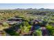 Aerial view of community tennis courts and a clubhouse at 4512 W Stoneman Dr, Anthem, AZ 85086
