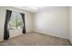 Well-lit bedroom featuring carpet flooring and a window with curtains at 4512 W Stoneman Dr, Anthem, AZ 85086