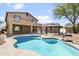 Inviting kidney-shaped pool with a large backyard at 4512 W Stoneman Dr, Anthem, AZ 85086