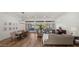 Open concept dining room with hardwood floors and large windows overlooking backyard at 6429 S Honor Ct, Gilbert, AZ 85298