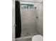 Shower stall with gray tile and a black shower curtain at 6429 S Honor Ct, Gilbert, AZ 85298