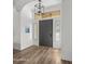 Bright entryway with dark gray door and wood-look flooring at 6429 S Honor Ct, Gilbert, AZ 85298