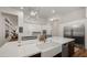 Gourmet kitchen with large island, farmhouse sink, and stainless steel appliances at 6429 S Honor Ct, Gilbert, AZ 85298