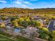 Aerial view of a luxury home community with mountains in the background at 6429 S Honor Ct, Gilbert, AZ 85298