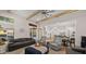 Open living room with exposed beams, fireplace, and access to backyard at 6429 S Honor Ct, Gilbert, AZ 85298