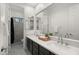 Bathroom with double vanity, modern fixtures, and patterned floor at 6429 S Honor Ct, Gilbert, AZ 85298