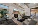 Bright living room with fireplace, comfortable seating, and large windows at 6429 S Honor Ct, Gilbert, AZ 85298
