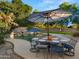 Inviting pool area with a waterfall and patio furniture at 6429 S Honor Ct, Gilbert, AZ 85298