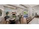 Spacious living room with fireplace, large windows, and access to patio at 6429 S Honor Ct, Gilbert, AZ 85298