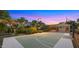 Outdoor basketball court and backyard area at sunset at 6429 S Honor Ct, Gilbert, AZ 85298