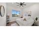 Comfortable bedroom with a queen-size bed and a large window at 6429 S Honor Ct, Gilbert, AZ 85298